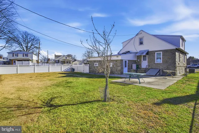 a view of a house with swimming pool yard and patio