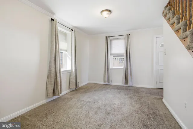 a view of livingroom with furniture and stairs