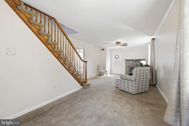 a kitchen with stainless steel appliances granite countertop a dining table chairs a stove a microwave a sink and dishwasher