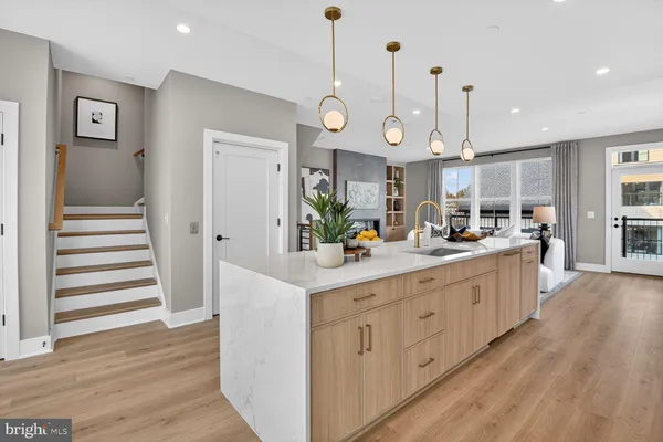 a living room with furniture and large windows