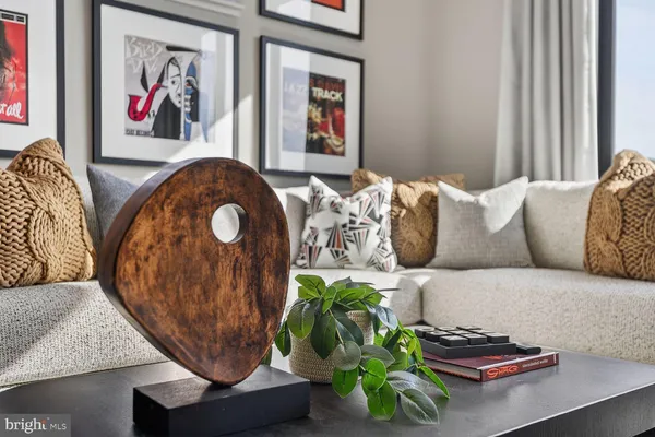 a living room with couch and a floor to ceiling window