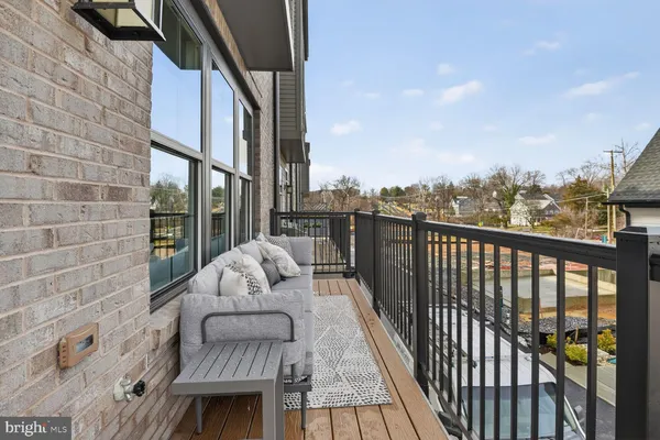 a kitchen with stainless steel appliances a stove center island cabinets and wooden floor