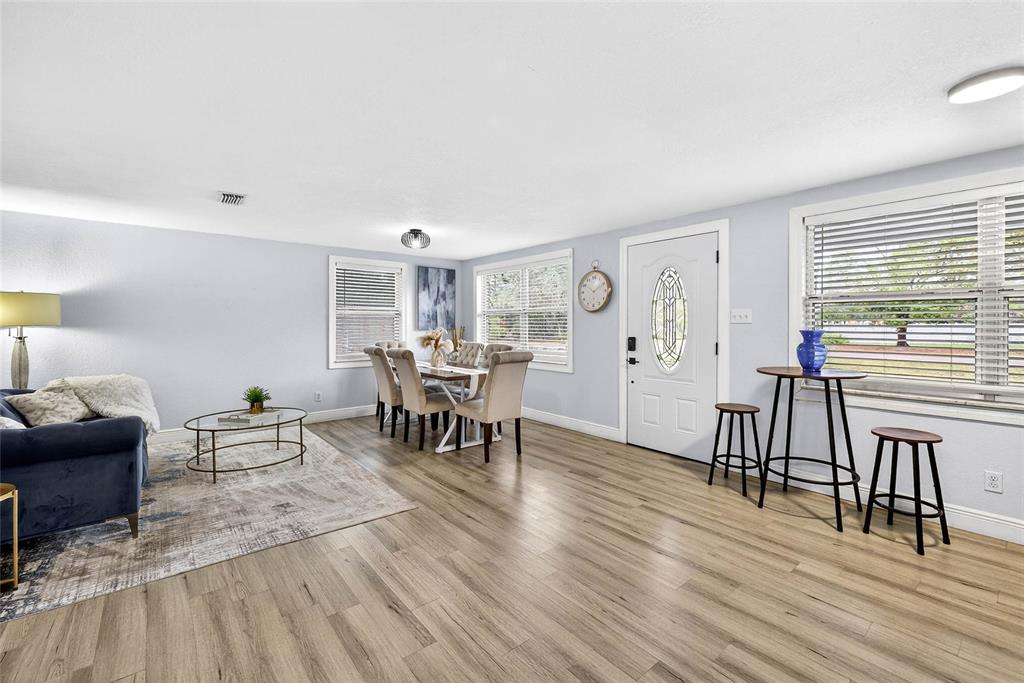 Undisclosed Address Riverview, FL 33578 - Photo 12 of 39 a living room with furniture and wooden floor
