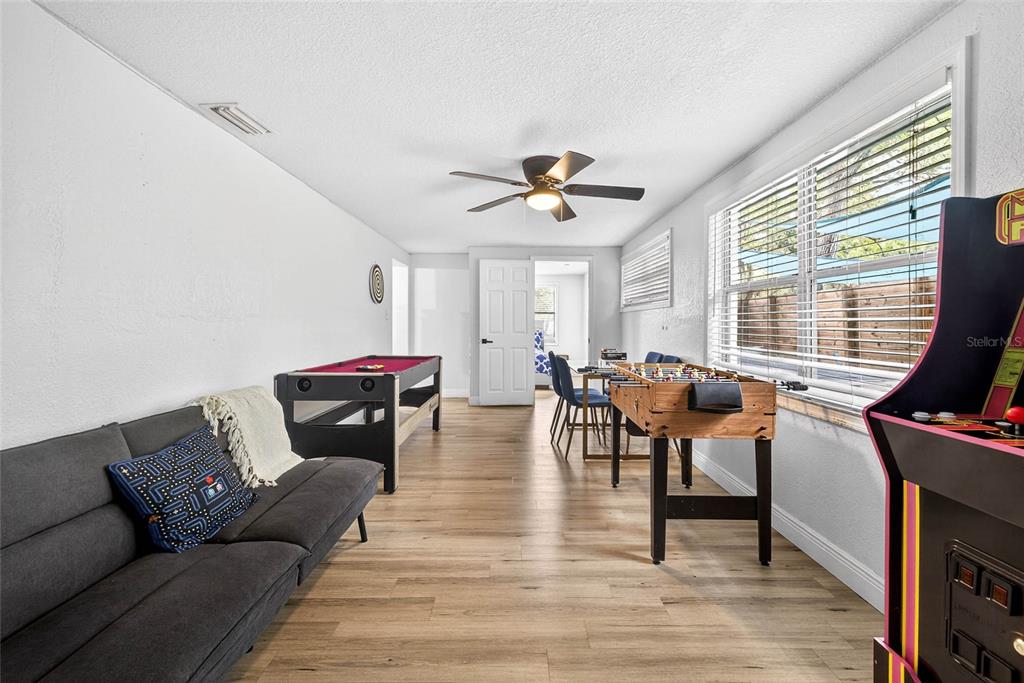 Undisclosed Address Riverview, FL 33578 - Photo 14 of 39 a living room with furniture a fireplace and a flat screen tv