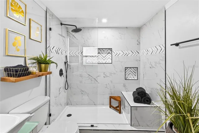 a view of a swimming pool with a patio and a fire pit