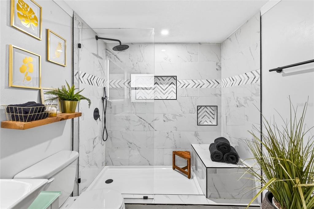 Undisclosed Address Riverview, FL 33578 - Photo 17 of 39 a bathroom with a tub a potted plant and a shower