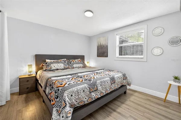 a bedroom with a bed and a window