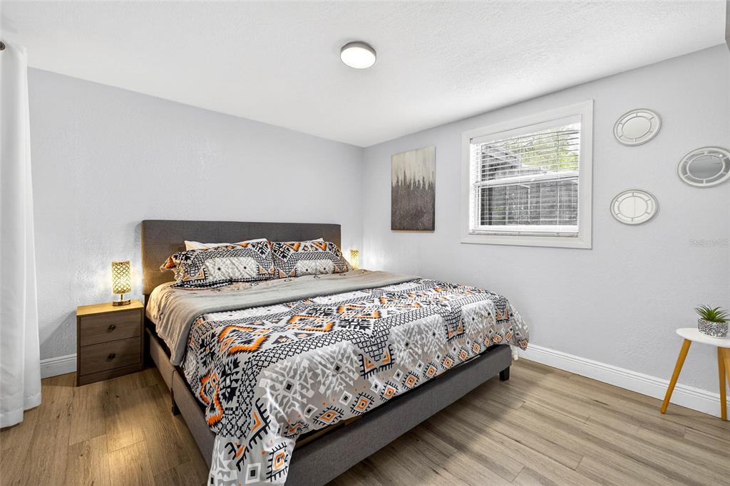 Undisclosed Address Riverview, FL 33578 - Photo 19 of 39 a bedroom with a bed and a window