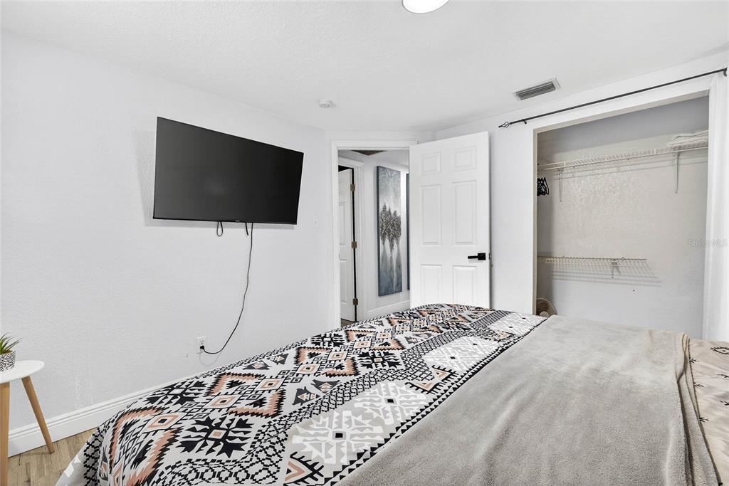 Undisclosed Address Riverview, FL 33578 - Photo 20 of 39 a bedroom with a bed and a flat screen tv