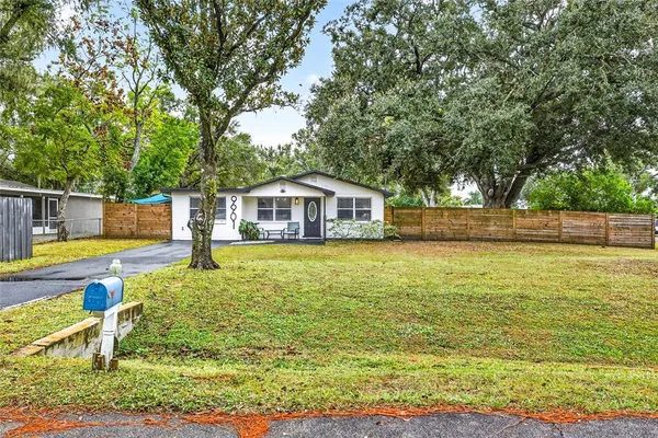 a view of house with swimming pool