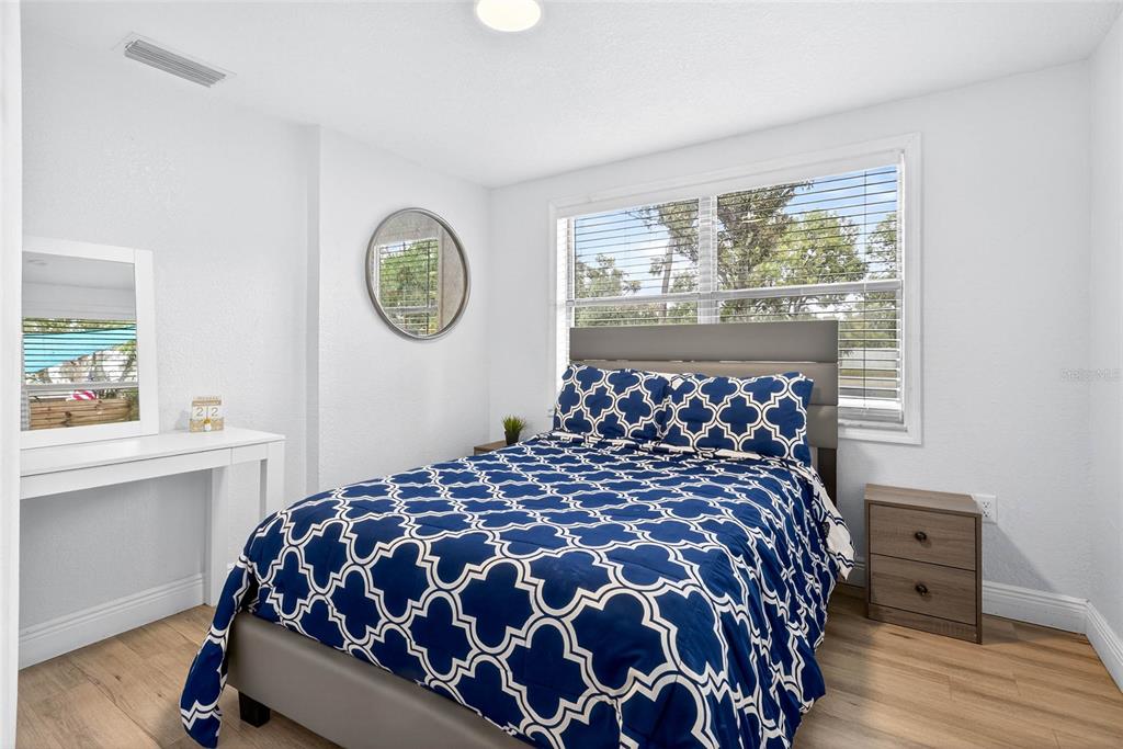 Undisclosed Address Riverview, FL 33578 - Photo 23 of 39 a large bed sitting in a bedroom next to a window