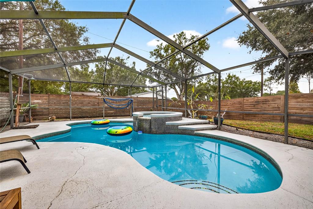 Undisclosed Address Riverview, FL 33578 - Photo 26 of 39 a view of a swimming pool with a patio