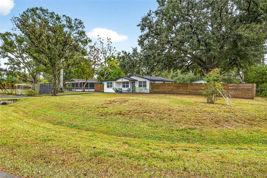 Undisclosed Address Riverview, FL 33578 - Photo 36 of 39 a swimming pool that has lawn chairs and a dining table under an umbrella