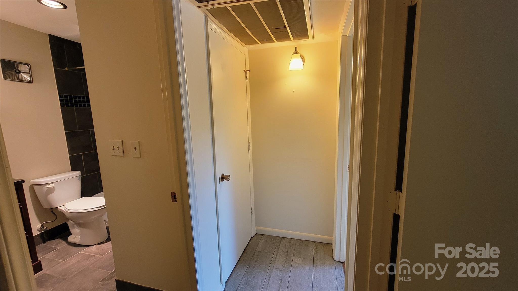 1323 Queens Road, Unit 320 Charlotte, NC 28207 - Photo 19 of 28 a bathroom with a sink and a toilet