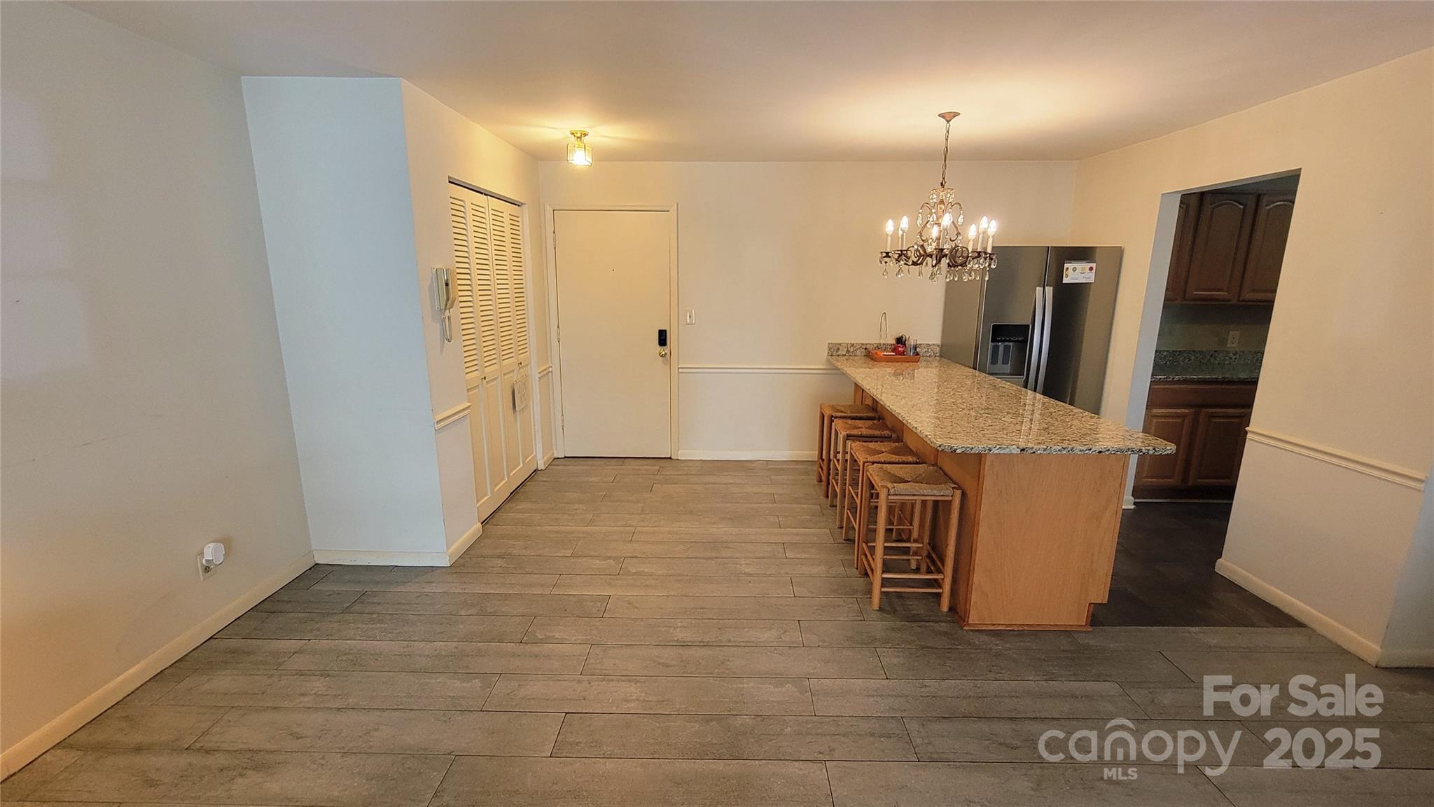 1323 Queens Road, Unit 320 Charlotte, NC 28207 - Photo 5 of 28 a view of a kitchen with a sink
