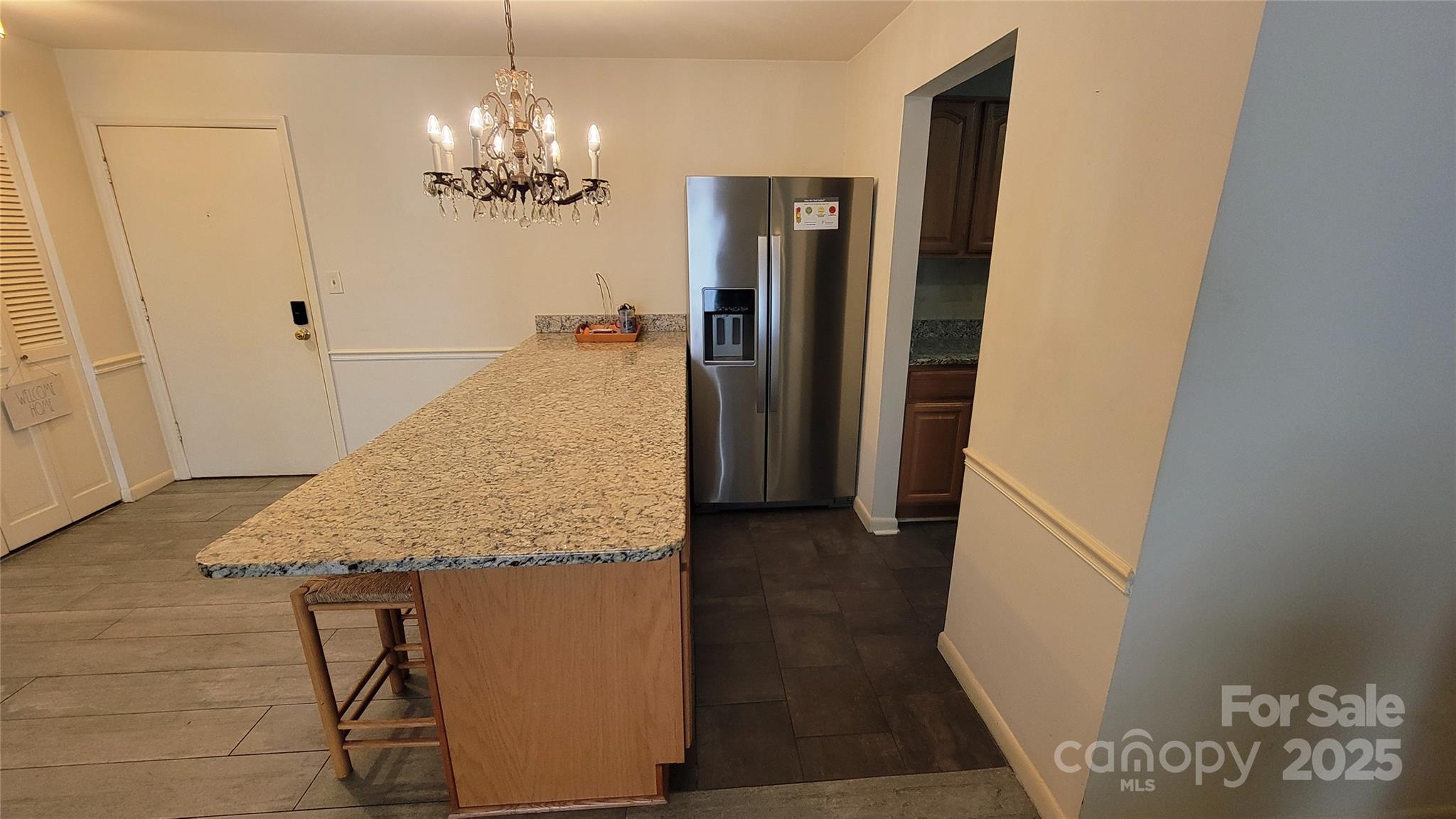 1323 Queens Road, Unit 320 Charlotte, NC 28207 - Photo 9 of 28 a bathroom with a granite countertop shower a sink and a mirror