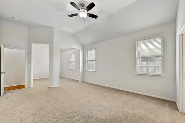 a view of an empty room with a window