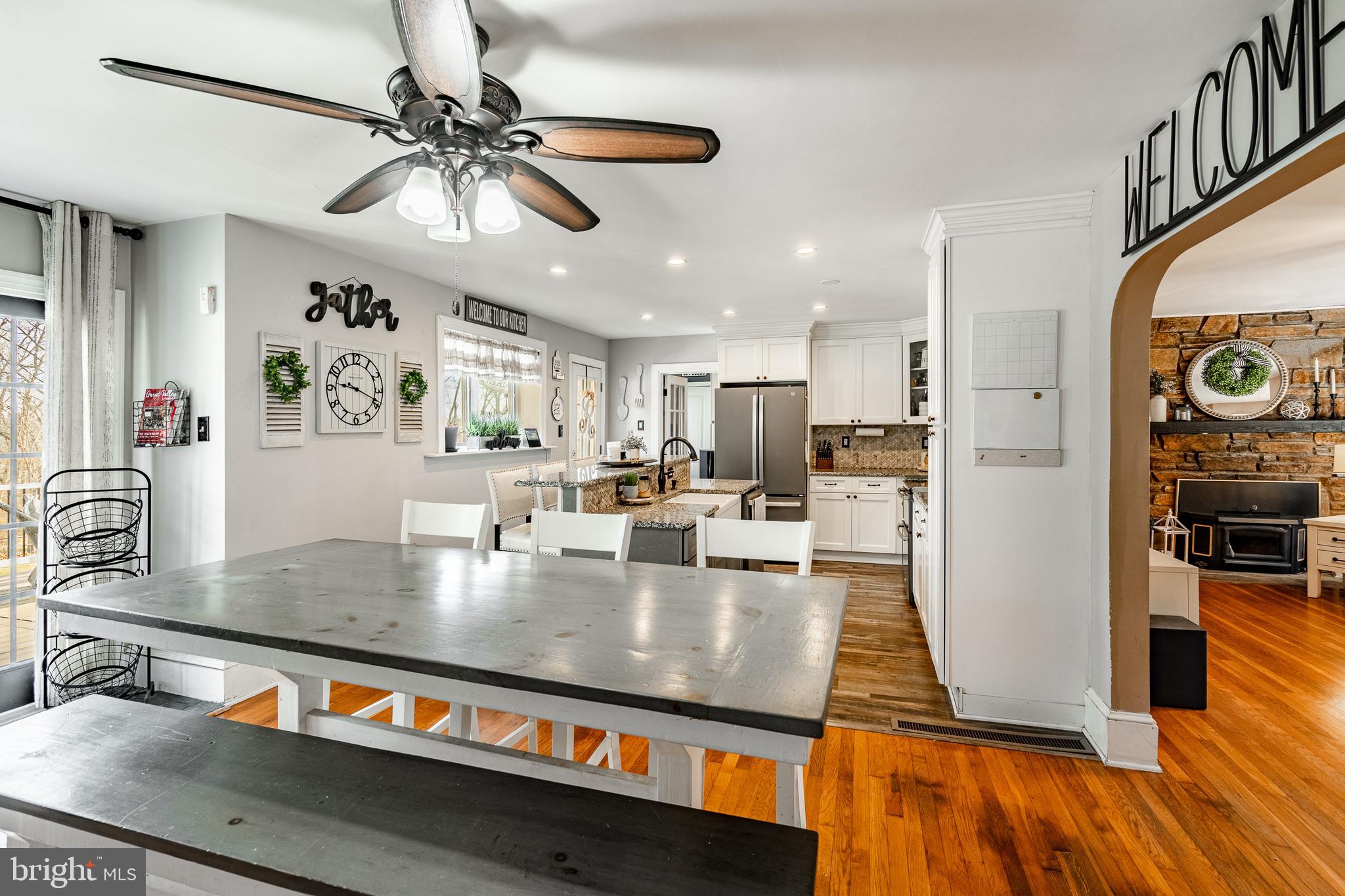 779 Concord Road Glen Mills, PA 19342 - Photo 13 of 64 a large kitchen with stainless steel appliances granite countertop a refrigerator a stove and a wooden floors