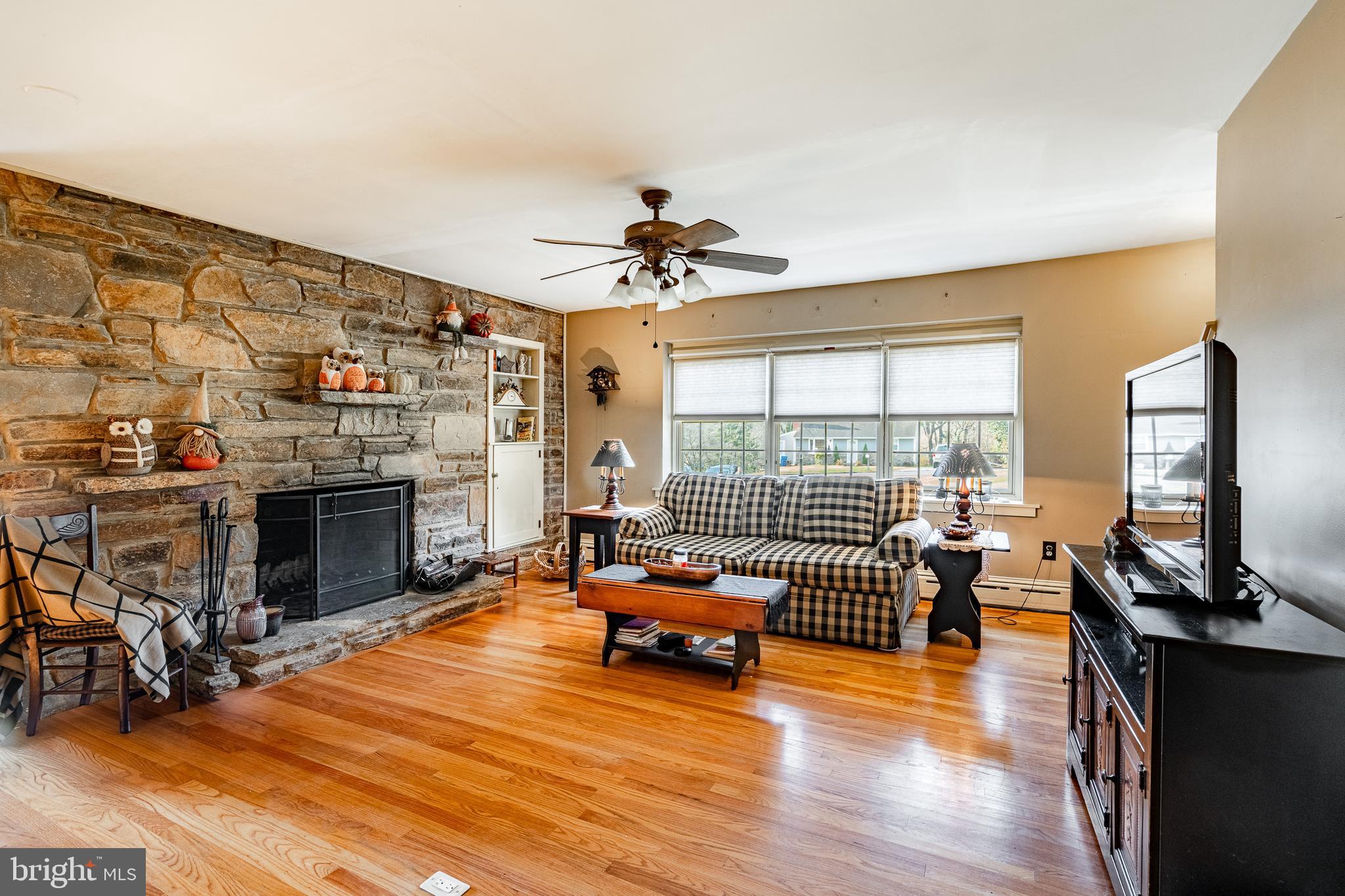 779 Concord Road Glen Mills, PA 19342 - Photo 18 of 64 a living room with furniture fireplace and flat screen tv