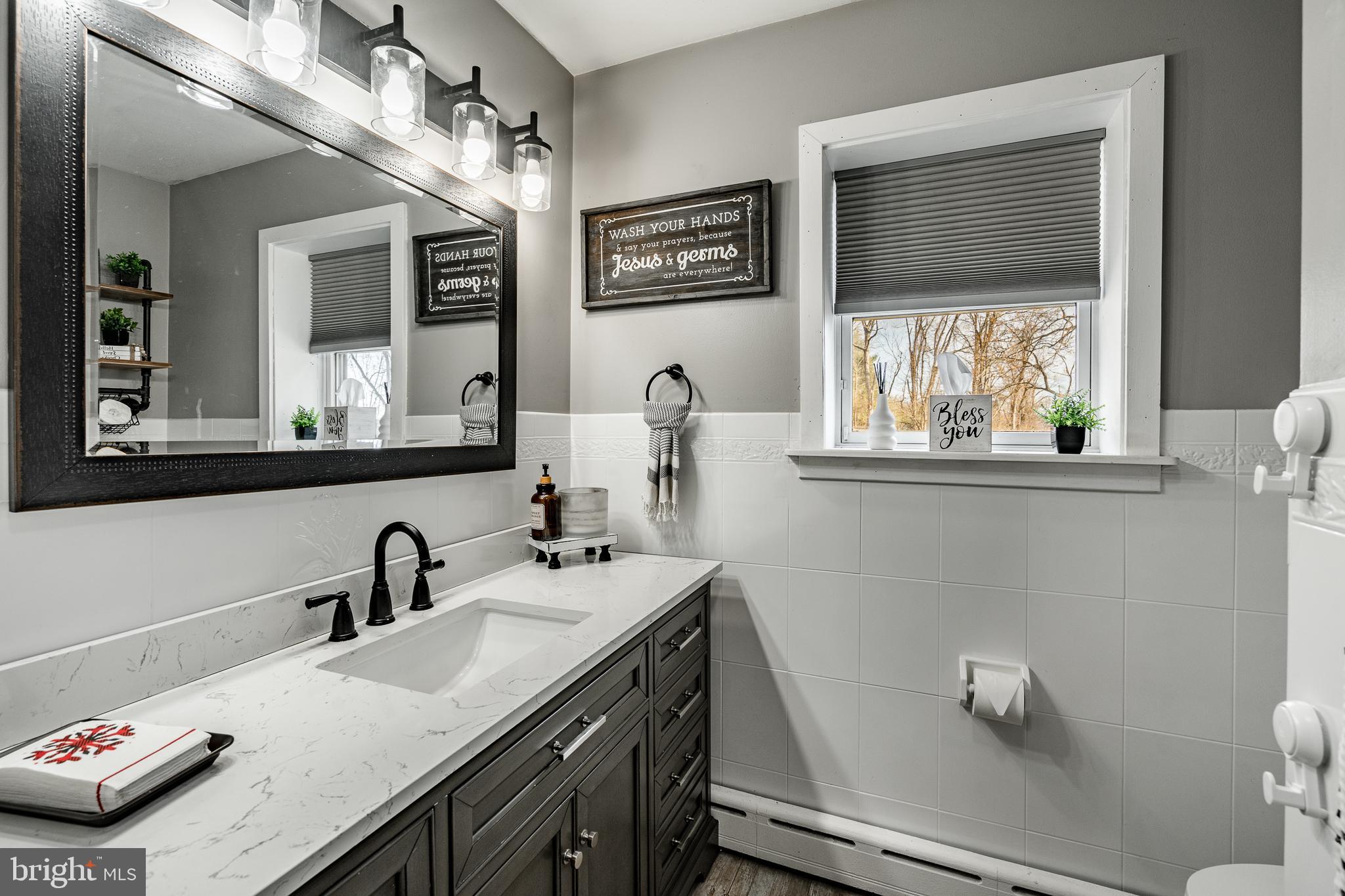 779 Concord Road Glen Mills, PA 19342 - Photo 30 of 64 a bathroom with a sink and a mirror