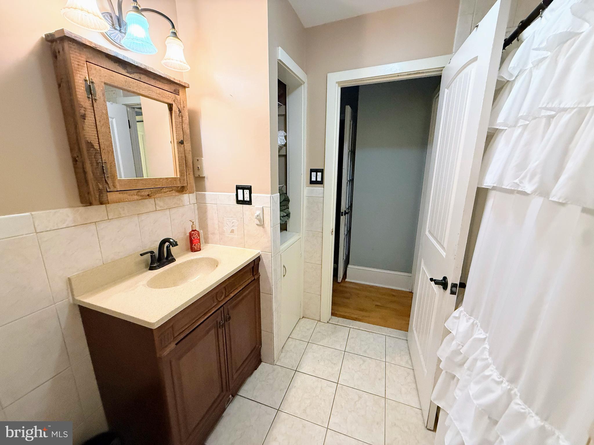 779 Concord Road Glen Mills, PA 19342 - Photo 35 of 64 a bathroom with a sink vanity and a mirror