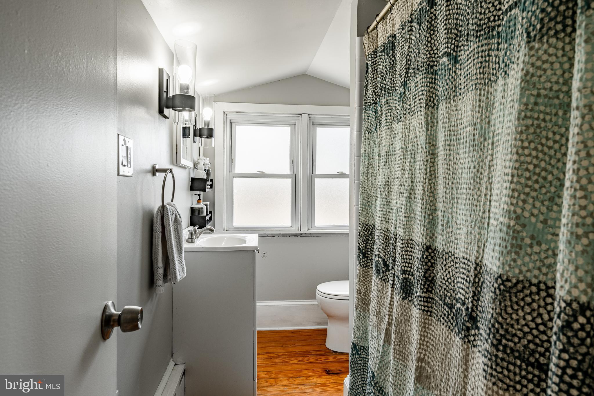 779 Concord Road Glen Mills, PA 19342 - Photo 40 of 64 a bathroom with a toilet sink and shower