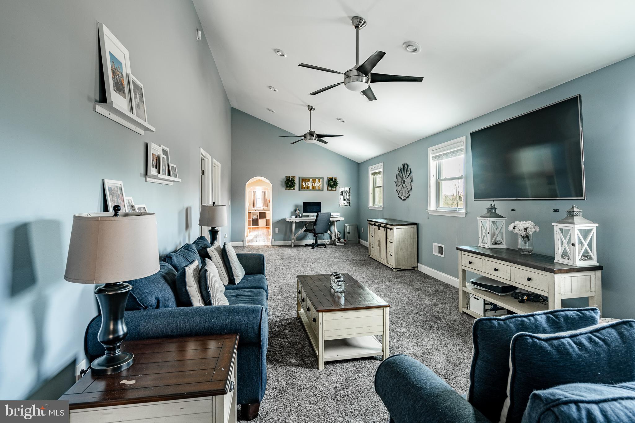 779 Concord Road Glen Mills, PA 19342 - Photo 46 of 64 a living room with furniture and a flat screen tv