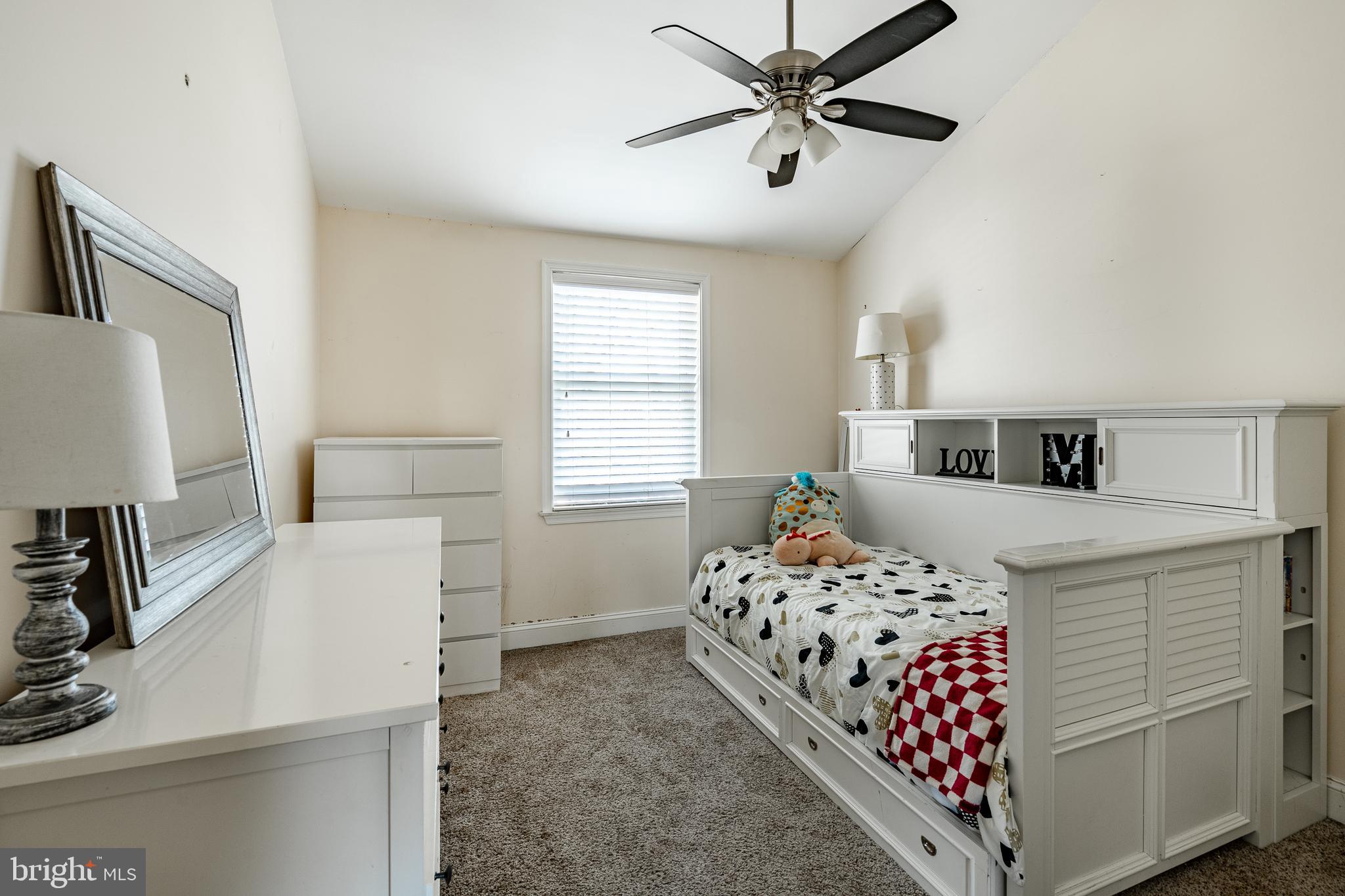 779 Concord Road Glen Mills, PA 19342 - Photo 50 of 64 a bedroom with a bed and a flat tv screen on the dresser