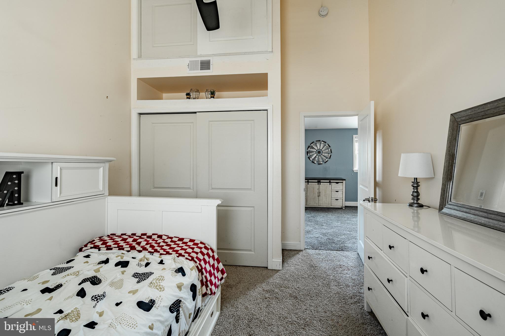 779 Concord Road Glen Mills, PA 19342 - Photo 51 of 64 a bedroom with a bed and a flat tv screen on the dresser