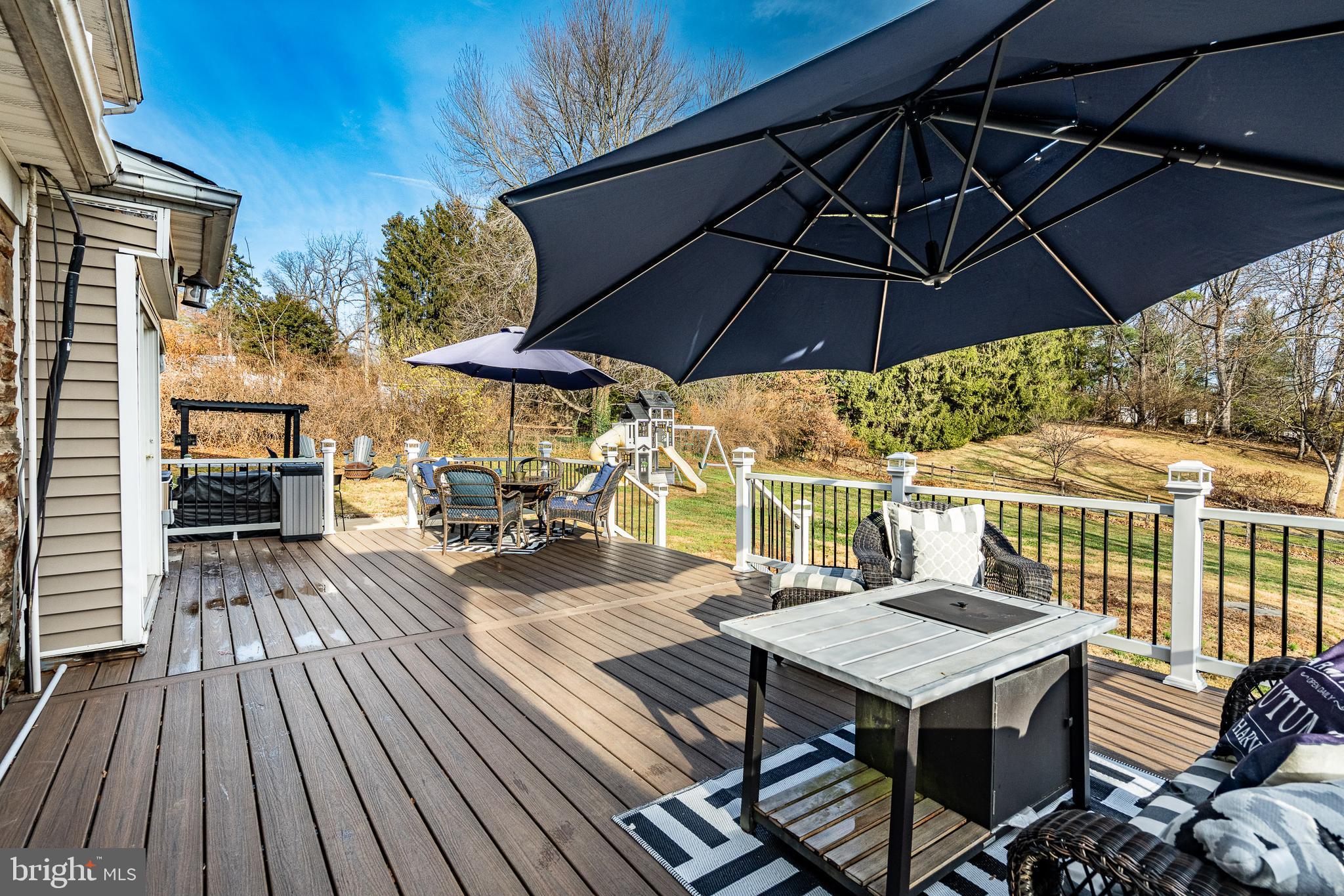 779 Concord Road Glen Mills, PA 19342 - Photo 62 of 64 an outdoor space with furniture and umbrella