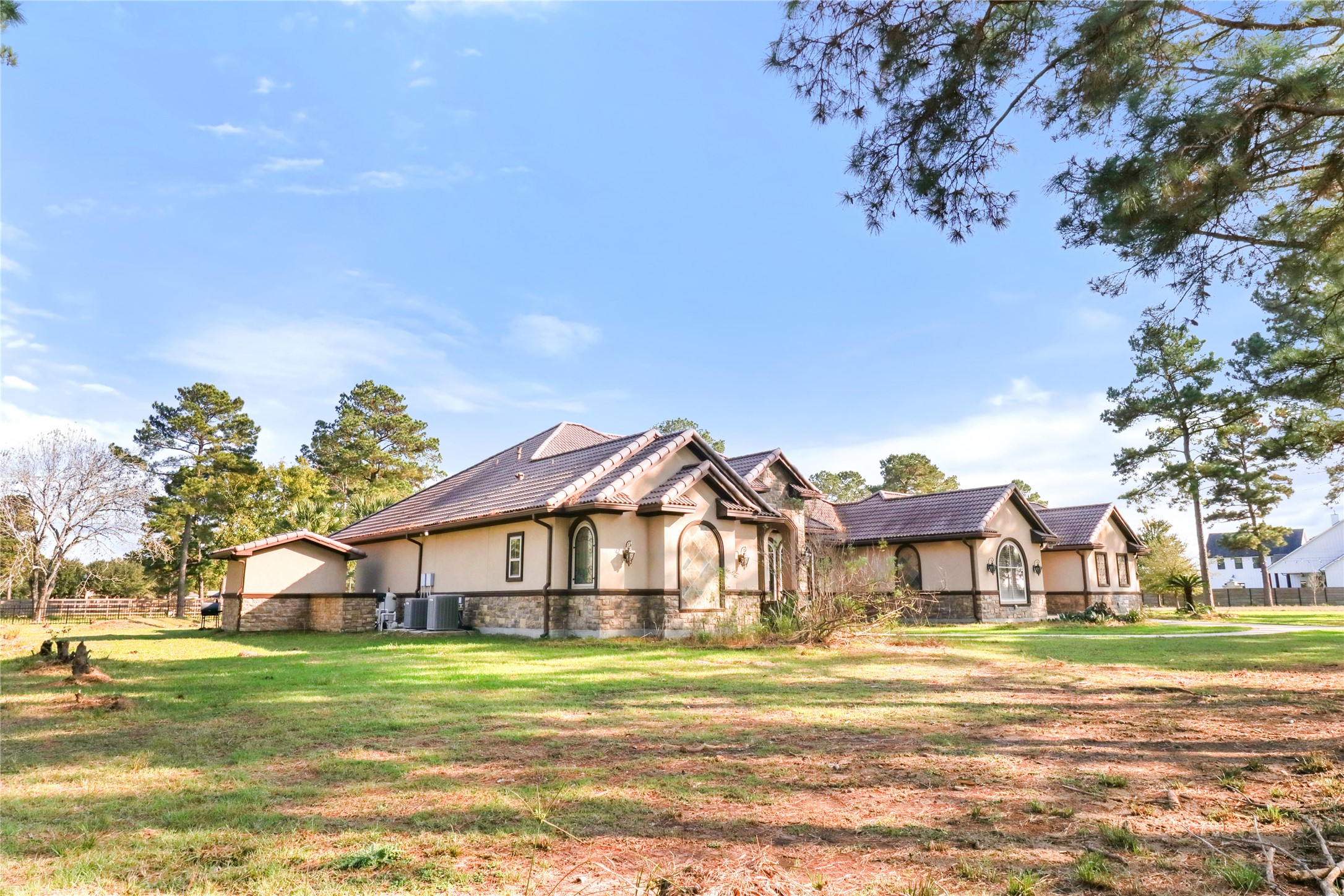 26325 Bauer Hockley Road Hockley, TX 77447 - Photo 11 of 40 a view of a big house with a big yard and large trees