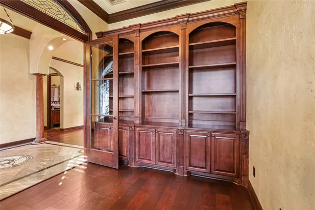 a view of a dining room with furniture wooden floor and chandelier