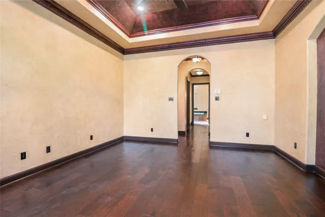 a bathroom with a tub a double vanity sink and mirror