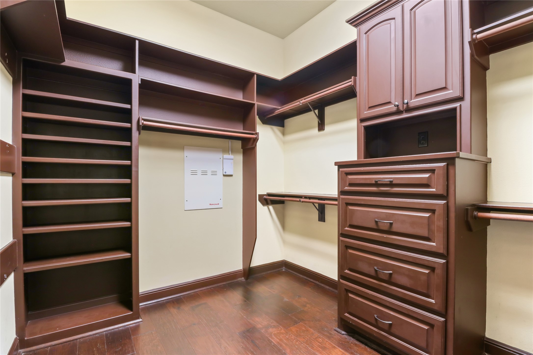 26325 Bauer Hockley Road Hockley, TX 77447 - Photo 23 of 40 a view of walk in closet with empty racks