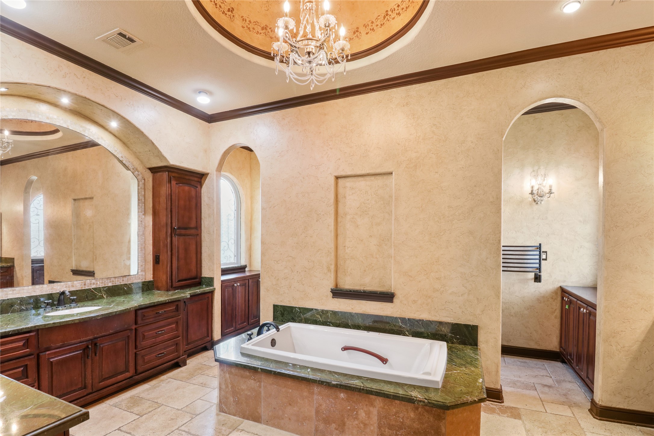 26325 Bauer Hockley Road Hockley, TX 77447 - Photo 24 of 40 a bathroom with a tub a double vanity sink and mirror