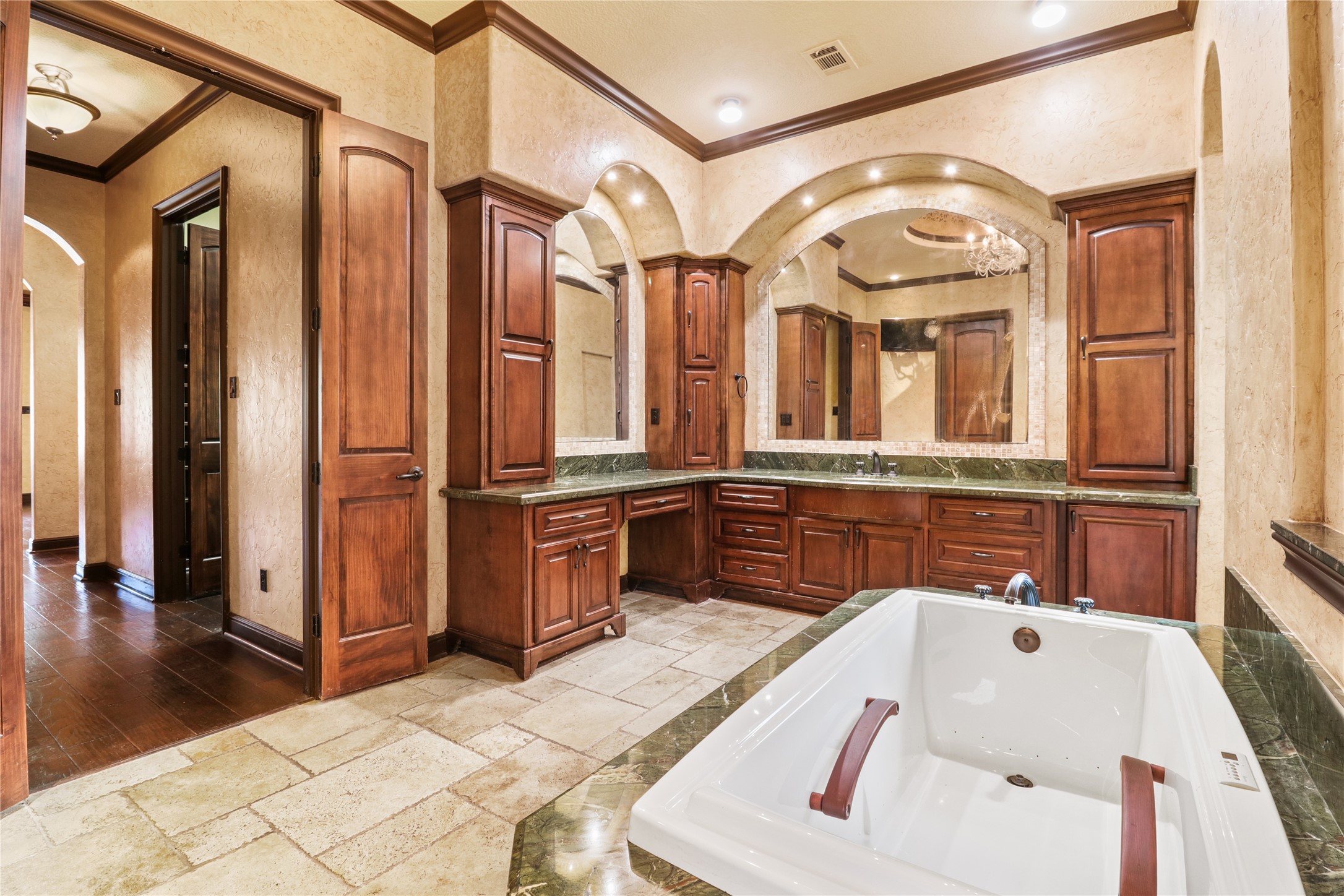 26325 Bauer Hockley Road Hockley, TX 77447 - Photo 25 of 40 a bathroom with a tub a sink and mirrors