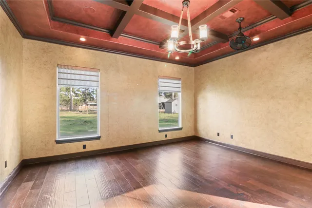 a kitchen with stainless steel appliances granite countertop a stove a refrigerator a kitchen island a sink and chairs