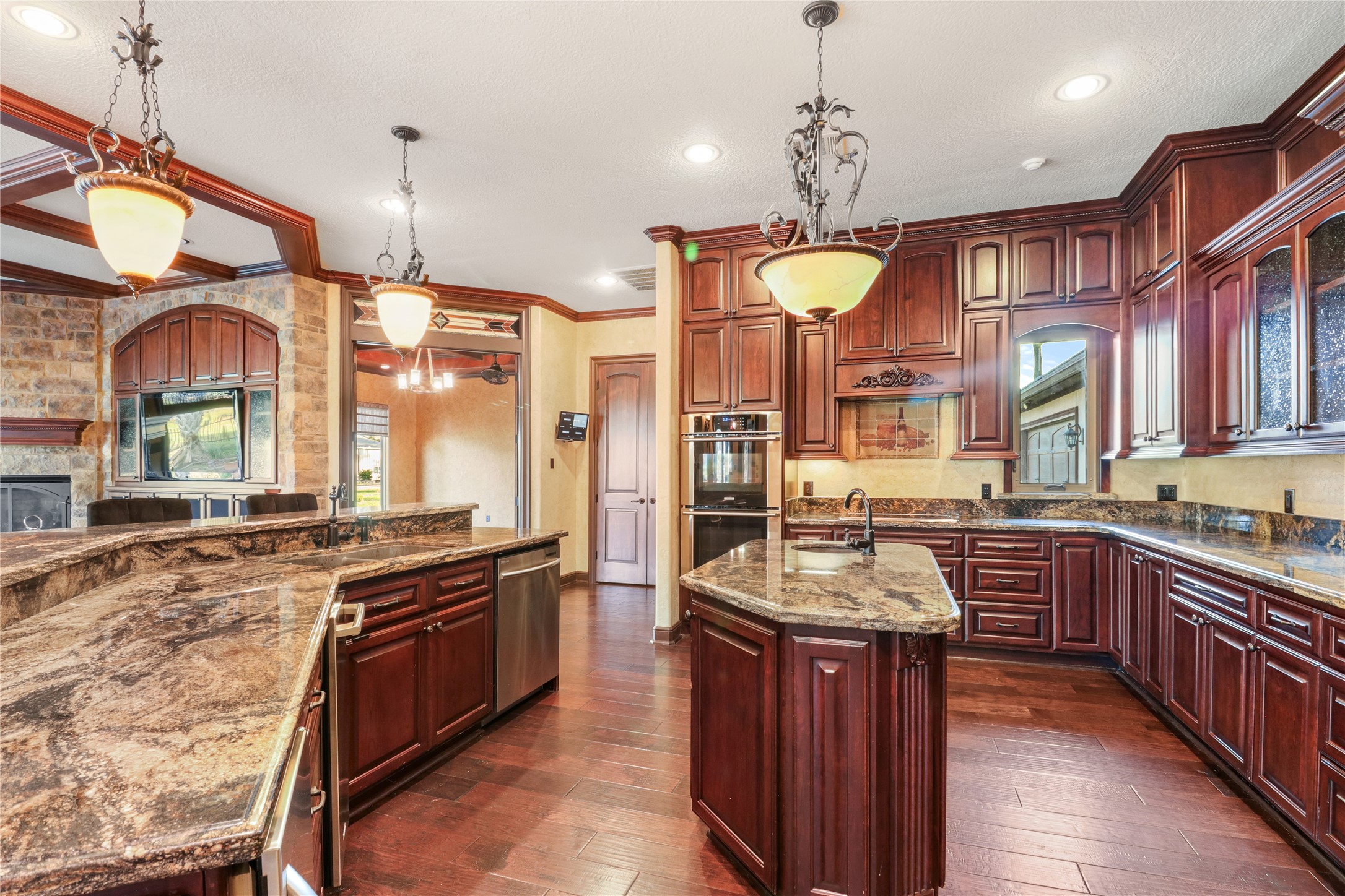 26325 Bauer Hockley Road Hockley, TX 77447 - Photo 37 of 40 a kitchen with stainless steel appliances granite countertop a stove a sink and a refrigerator