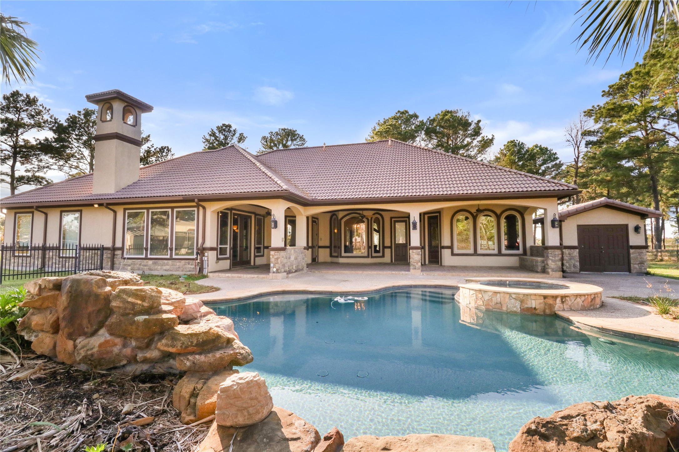 26325 Bauer Hockley Road Hockley, TX 77447 - Photo 8 of 40 a front view of a house with swimming pool having outdoor seating
