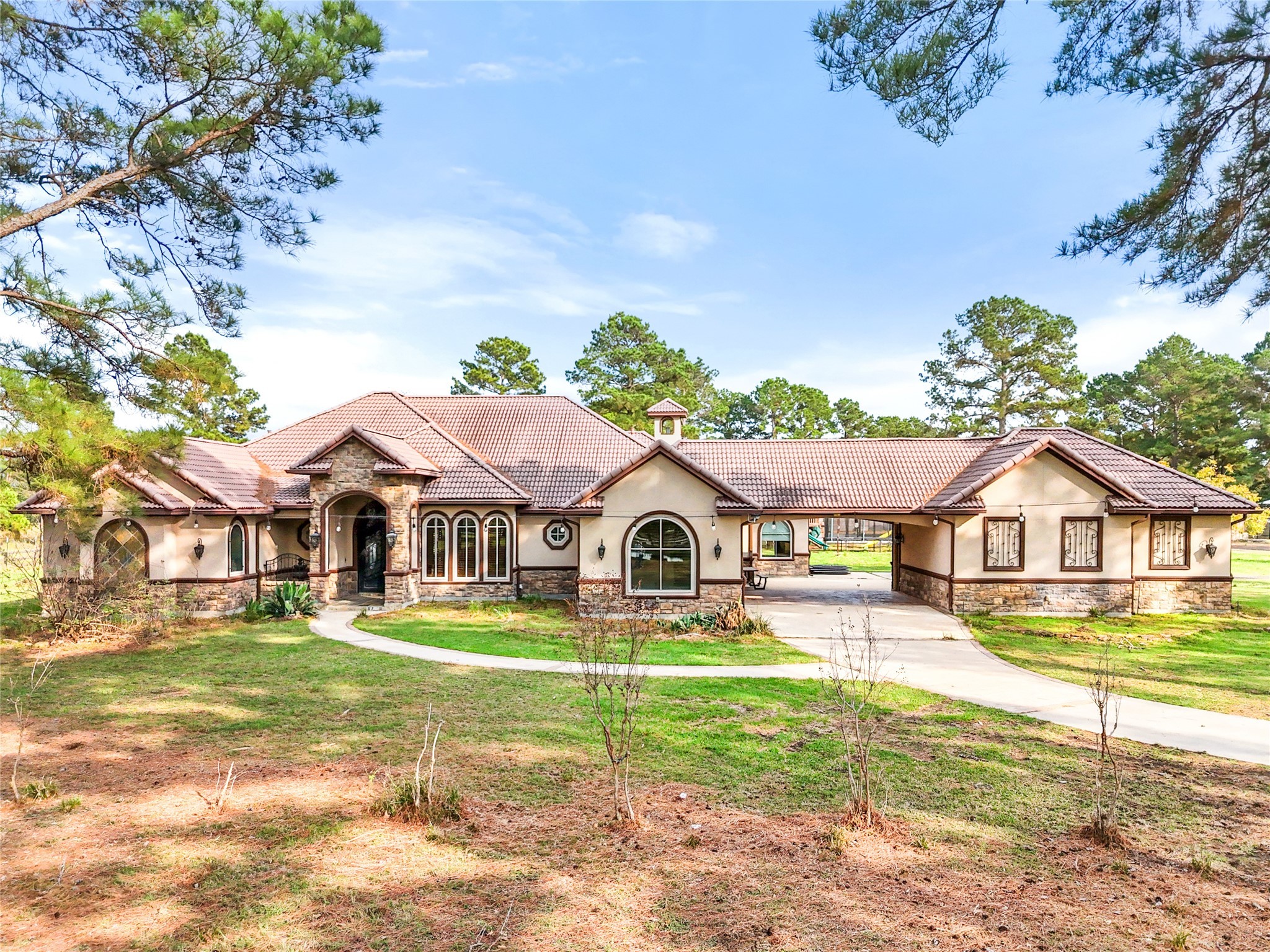 26325 Bauer Hockley Road Hockley, TX 77447 - Photo 9 of 40 a view of a yard in front of a house with large trees