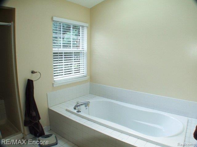 2119 Timber Ridge Court Highland, MI 48357 - Photo 12 of 22 Garden tub with skylight