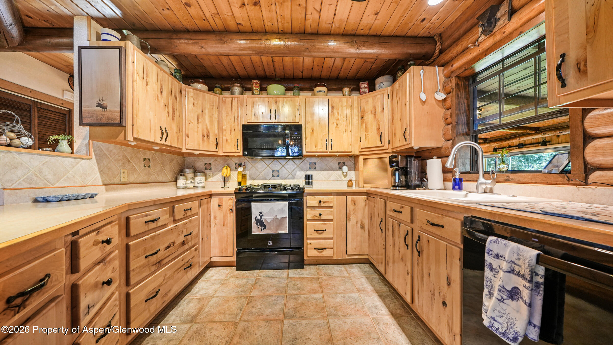 1355 N Road Loma, CO 81524 - Photo 17 of 51 a kitchen with cabinets and window