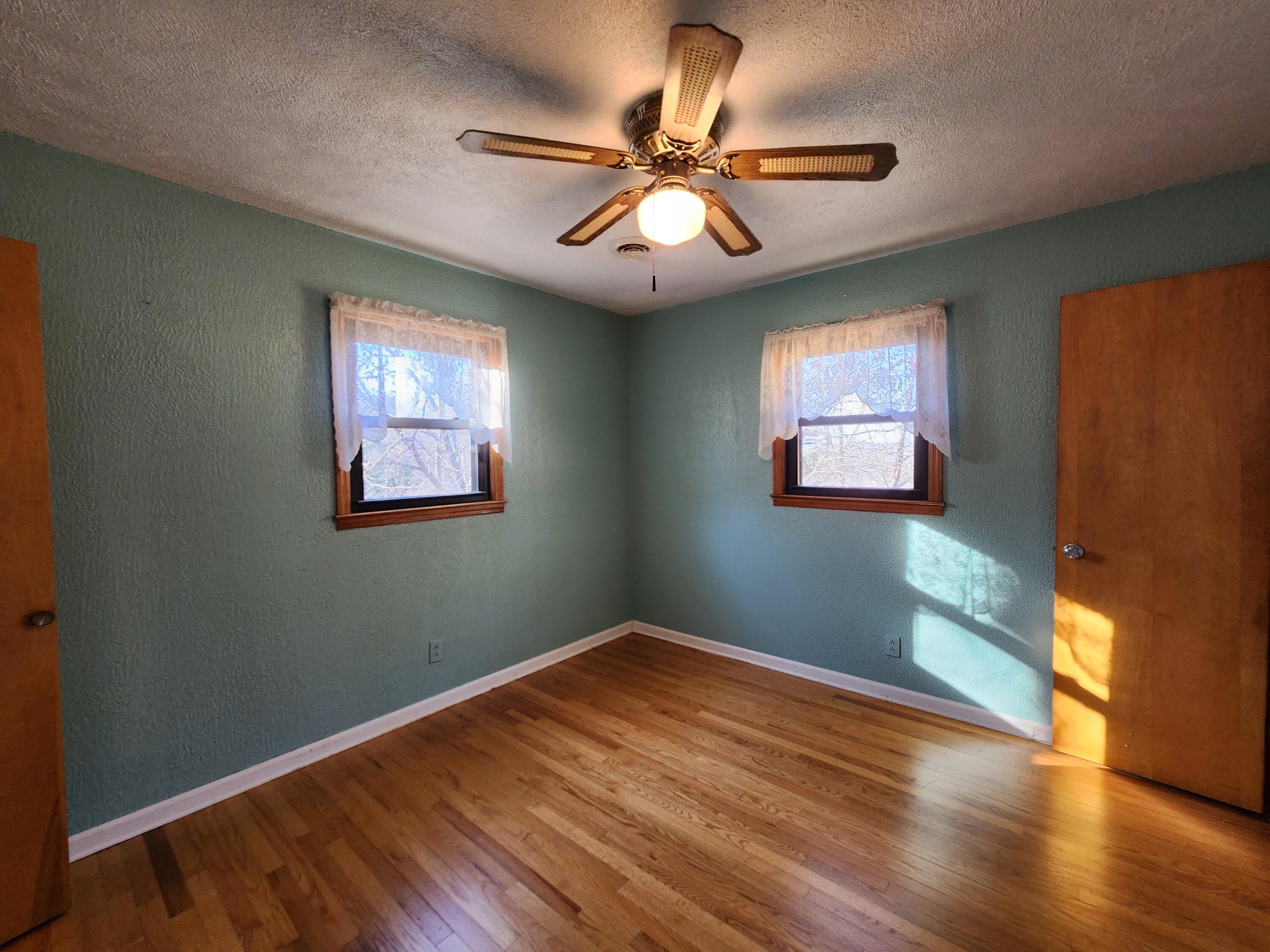 10519 Henry Road Henry, VA 24102 - Photo 17 of 26 a view of empty room with wooden floor