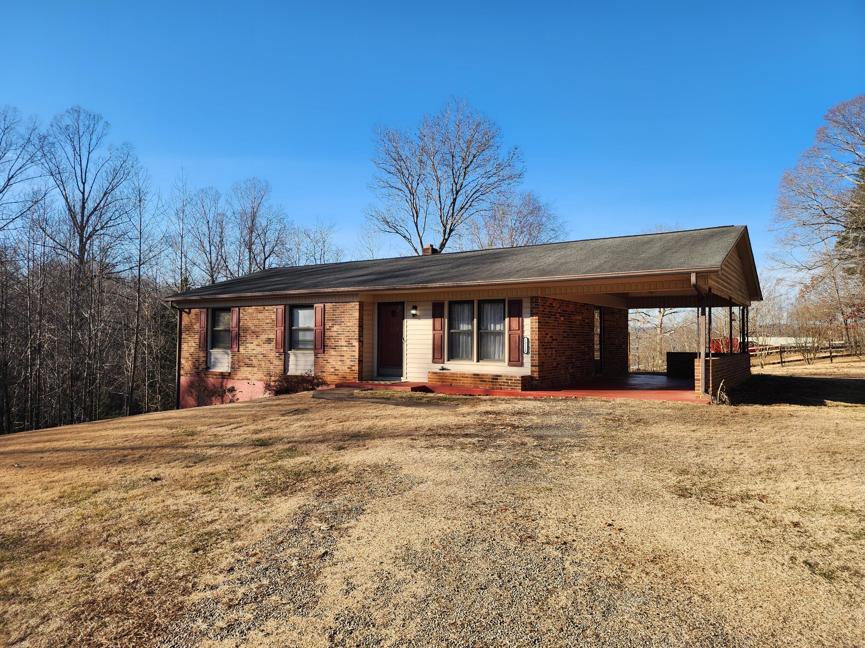 10519 Henry Road Henry, VA 24102 - Photo 3 of 26 a view of a house with a yard and garage