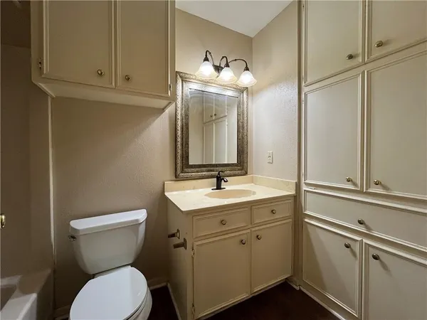 a bathroom with a toilet and a bathtub