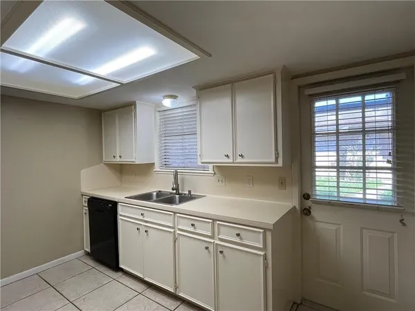 a kitchen with stainless steel appliances a sink stove and refrigerator