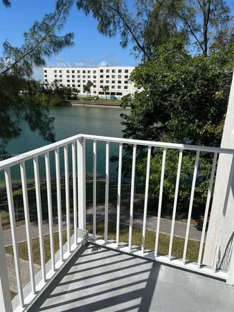 a view of an empty room and a window