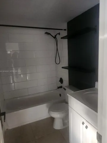 a bathroom with a shower and a toilet
