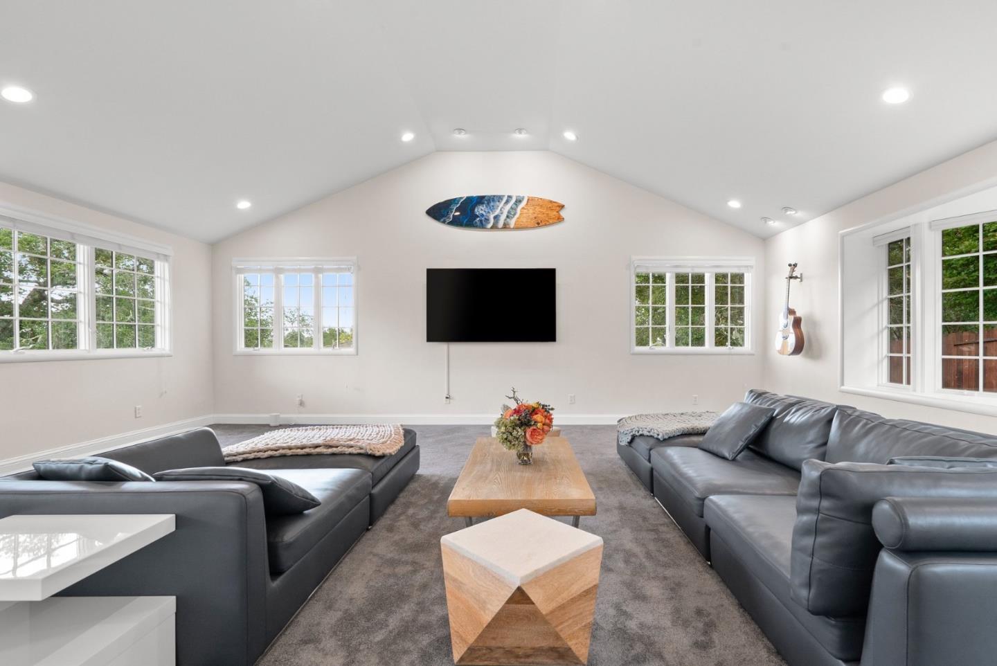 770 Graham Hill Road Santa Cruz, CA 95060 - Photo 37 of 83 a living room with furniture and a flat screen tv