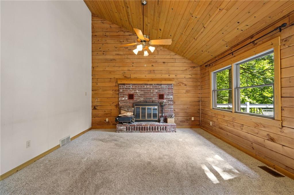 1335 Alamae Lakes Road Washington, PA 15301 - Photo 20 of 50 a view of an empty room with a fireplace and a window